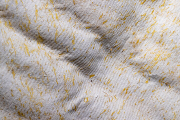 fabric from which the mattress is made in spots of glue with which the components of the mattress were glued together
