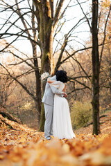 Two souls, one heart. Soon to be husband and wife, wrapped in love and holding dreams  and a bouquet, in the middle of forest 