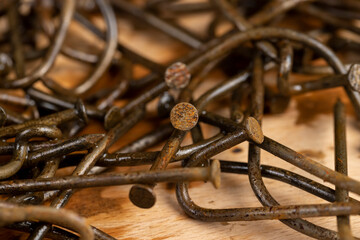 nails covered with orange rust, damaged metal nails covered with rust, closeup