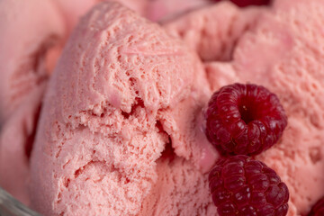 red ice cream in a glass, sweet frozen red ice cream with raspberry flavor closeup