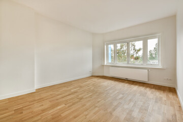 A bright and airy room showcasing minimalistic interior design with natural light streaming through...