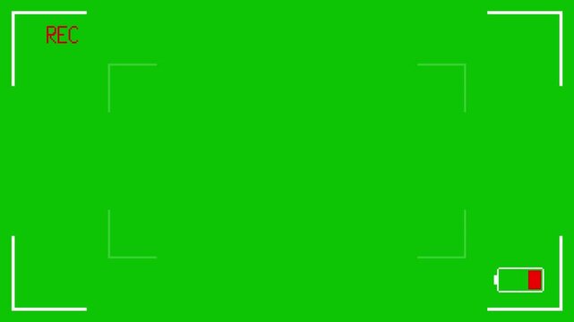 Camcorder screen interface with low battery signal. Pixel art animation of camera recording screen on green background.