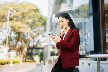 Fototapeta premium oung Asian business woman leader entrepreneur, professional manager holding digital tablet computer