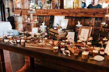 A sweet symphony of love. Cakes, treats, and the wedding cake itself tempt with beauty and flavor — a delicious celebration of the couple’s sweetest day