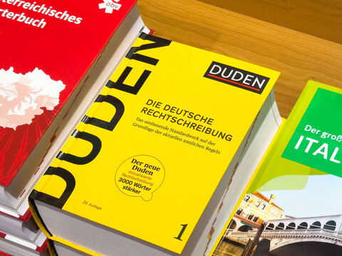 German language reference book: duden german orthography guide on table