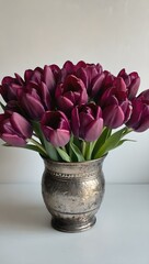 wine red tulips in a vase