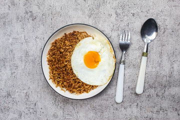 fried noodles and egg on a plate