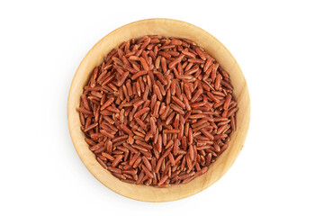 red rice in a wooden bowl isolated on white background. Top view. Flat lay
