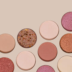 Colorful Swatches eyeshadow refills as minimal geometric pattern. Matte and glitter pans red brown pink shade with sun shadows, detail texture, cosmetic, beauty product, makeup, warm color scheme