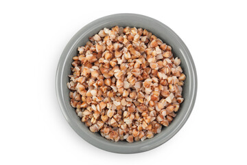 Boiled buckwheat in a ceramic bowl isolated on white background. Top view. Flat lay