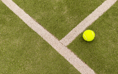 tennis balls on tennis grass court