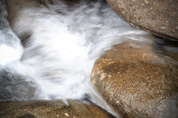 A small stream flows through the rocks.