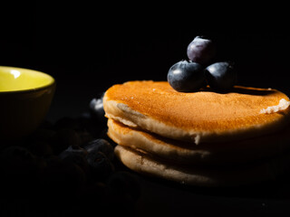 Ripe Blueberries on pancakes fruit macro close up