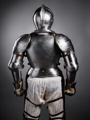 Back View of Medieval Suit of Armor on Display with Intricate Details..