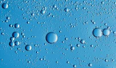 Transparent Cosmetic gel with oxygen bubbles on blue background, Moisturising transparent gel