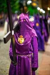 Penitents carry wooden crosses during Holy Week in Seville