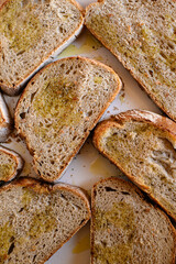 Crunchy sourdough bread croutons with butter, salt, and spices on a small plate. Rustic homemade snack, perfect for cozy breakfasts or appetizers