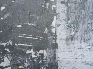Paper poster sticker on gray wall, Ripped glued paper texture background