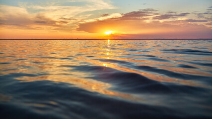 Fototapeta premium Golden Hour Light on Rippling Water