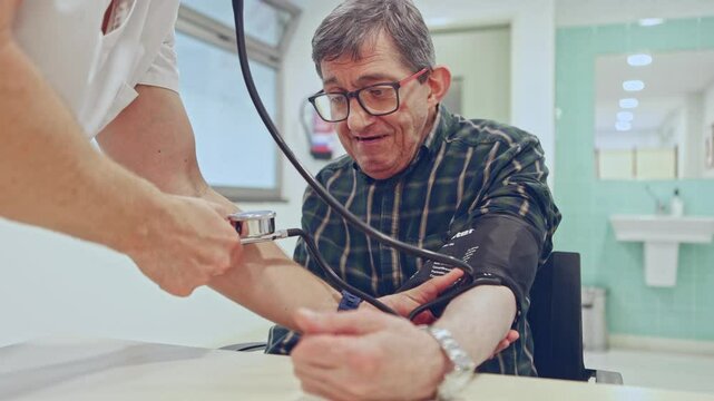 Doctor performing blood pressure check in mental health facility