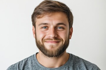 Fototapeta premium A handsome young man with a full beard smiles brightly