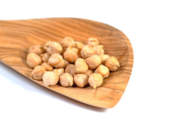 Chickpeas, Cicer arietinum, on a wooden spoon