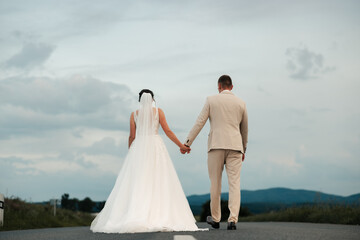 Together on the road ahead, hand in hand. Standing still for a moment, yet moving toward forever...