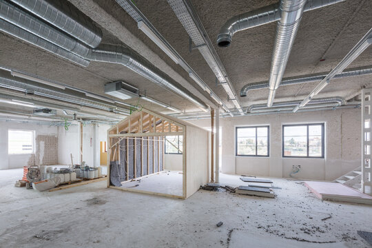 Modern office under construction with exposed duct work