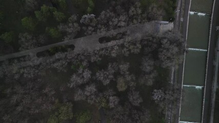 Almaty, Kazakhstan - 04.04.2025 : The river is in the center of the city. Different architecture. The view from the drone. Spring time.