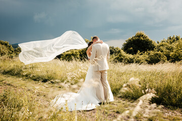Among the trees, hand in hand, they walk into their forever. Nature surrounds them in silence and peace — a perfect backdrop for the beginning of their love story