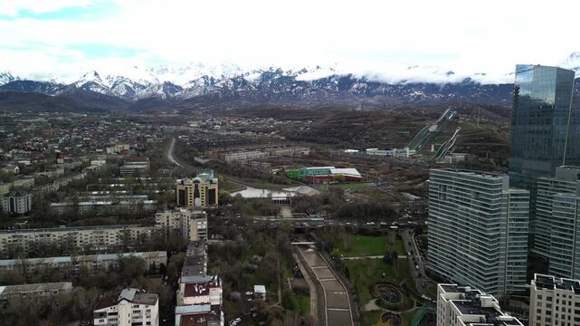 Almaty, Kazakhstan - 04.04.2025 : The river is in the center of the city. Different architecture. The view from the drone. Spring time.