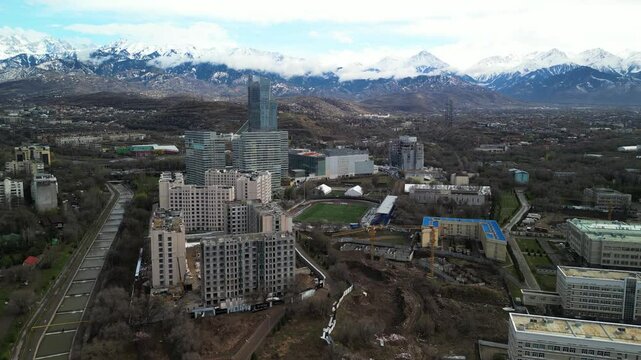 Almaty, Kazakhstan - 04.04.2025 : The river is in the center of the city. Different architecture. The view from the drone. Spring time.