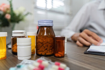 Medication Management and Prescription Review. An array of prescription bottles and medications...
