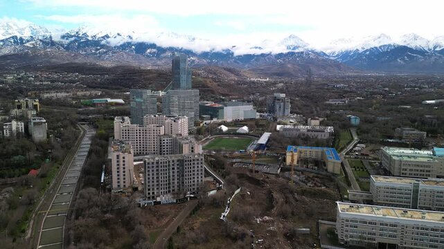 Almaty, Kazakhstan - 04.04.2025 : The river is in the center of the city. Different architecture. The view from the drone. Spring time.