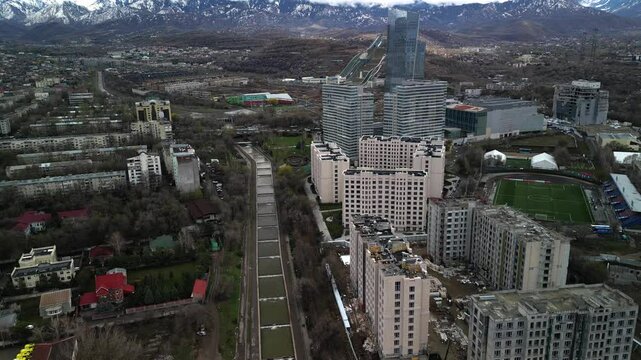 Almaty, Kazakhstan - 04.04.2025 : The river is in the center of the city. Different architecture. The view from the drone. Spring time.