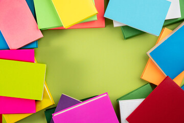 Background of books with copy space. Many colorful books. Concept of school library, children's literature, textbooks for teenagers.