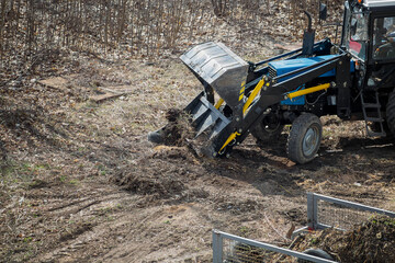 Clearing the area of debris using a construction loader is a technological advancement in...