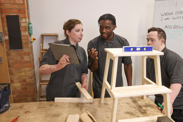 Disabled men and woman at workshop