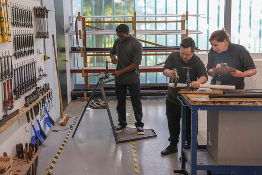 Disabled men and woman at workshop