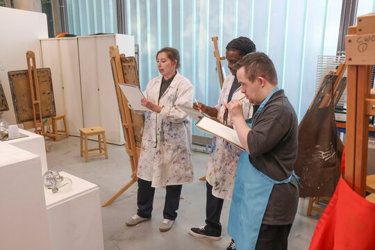 Disabled people drawing at workshop