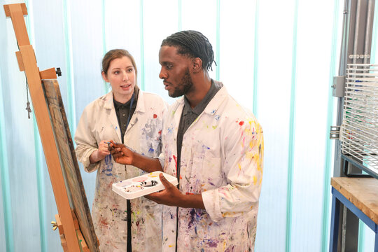 Disabled people painting at workshop