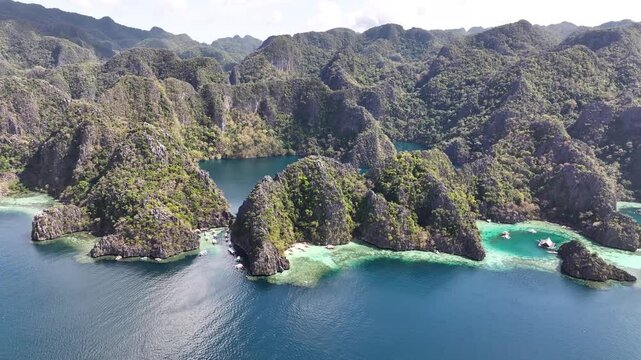 Aerial panoramic of amazing coastal landscape of Coron Island, with Twin Lagoon and Baracuda Lake.