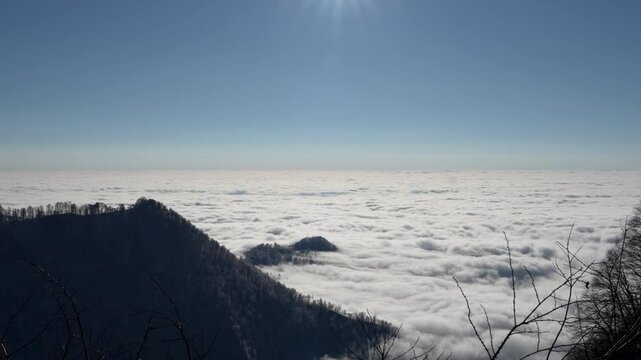 Stunning cloud cover blankets the Tufandag mountains with sunlit skies overhead. Gabala, Azerbaijan