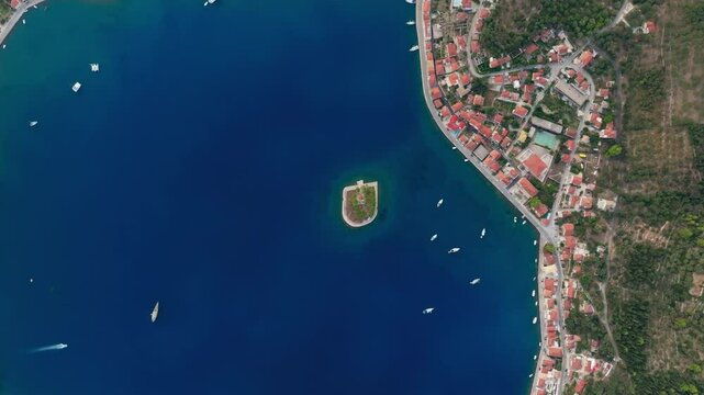Top down drone shot of small islet of Lazareto on Ithaca island, Greece