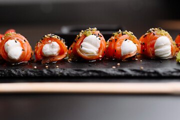 Delicious Salmon and Cream Cheese Rolls Served on Slate Plate