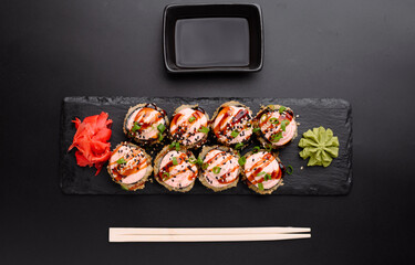 Delicious Sushi Platter with Wasabi and Pickled Ginger on Slate