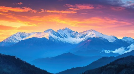 Snow-capped mountains against a vibrant sundown sky