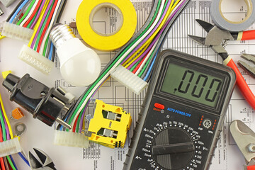 Digital Multimeter and Mounting Tools for Electrical Switchboard Assembly on Electronic Digram. 