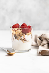 yogurt with granola and raspberries