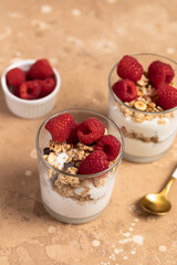 yogurt with granola and raspberries, breakfast